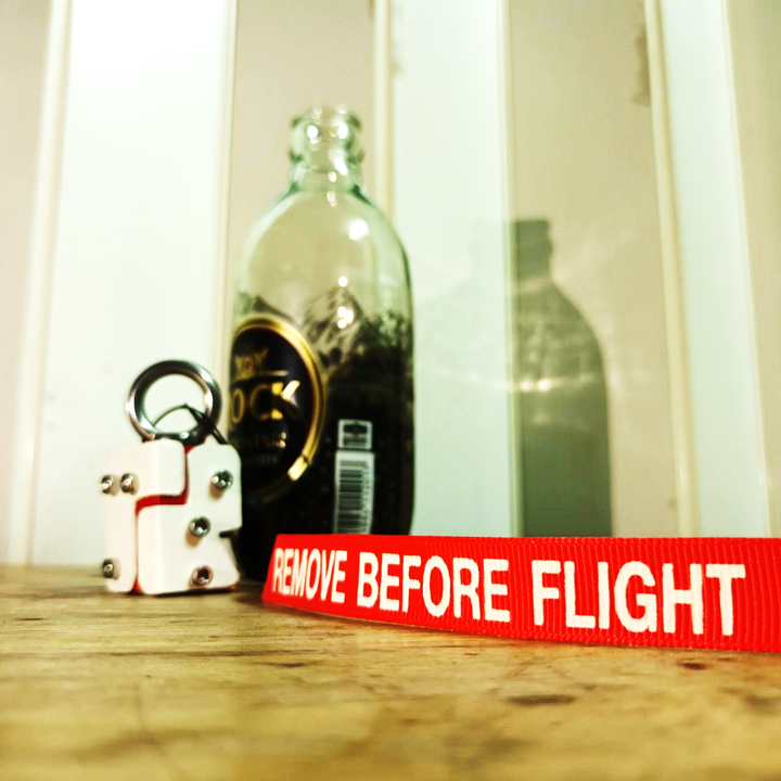 THE CAP OPENER WARNINGMAN REMOVE BEFORE FLIGHT MODEL 02